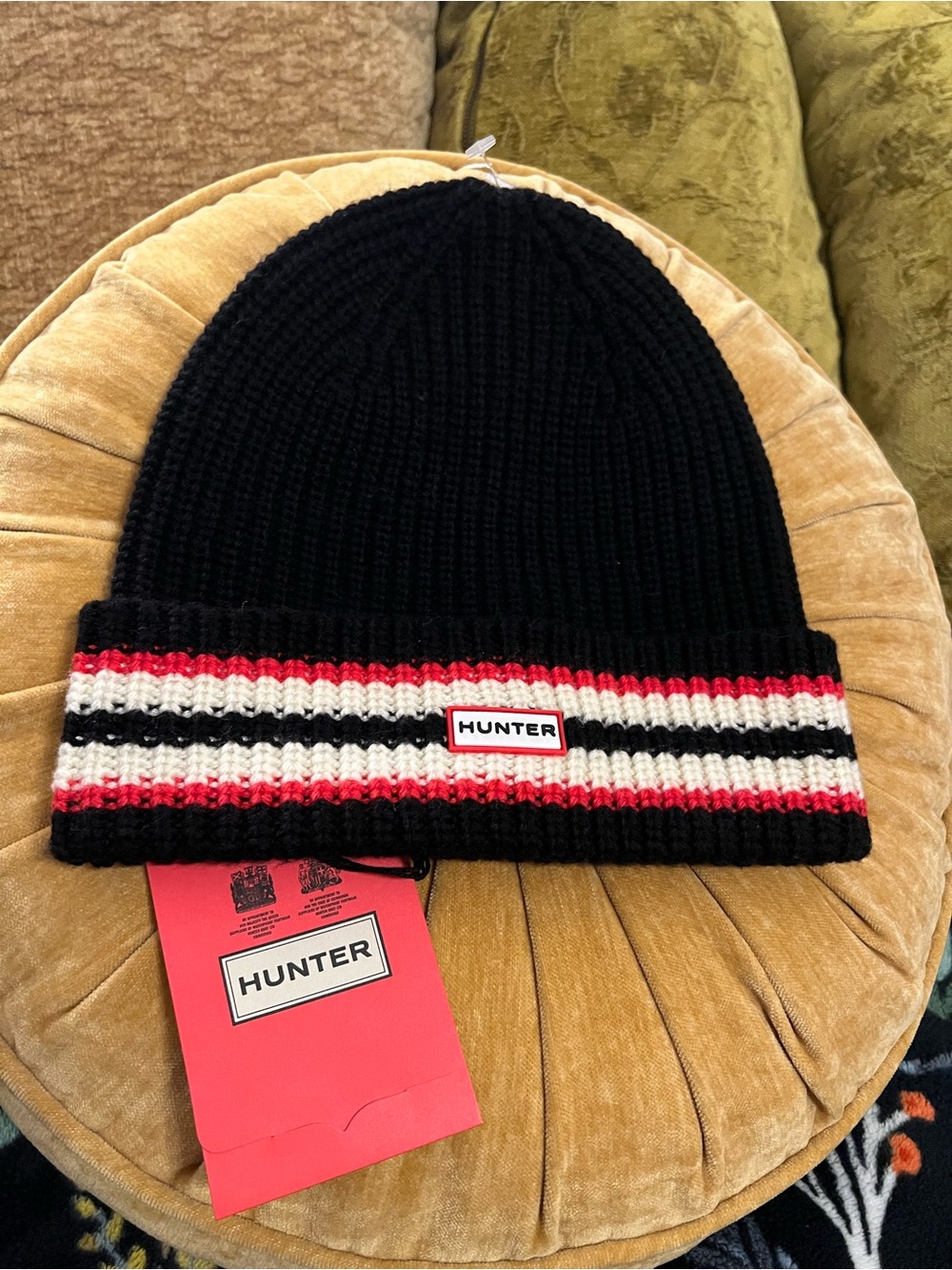 Hunter Black Knit Beanie with Red and White Striped Cuff